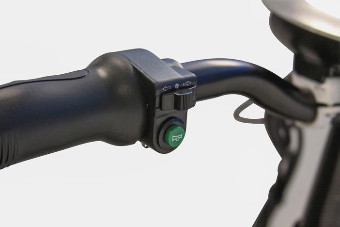 5. Turn Signals The turn signal button is located on the left handlebar assembly.