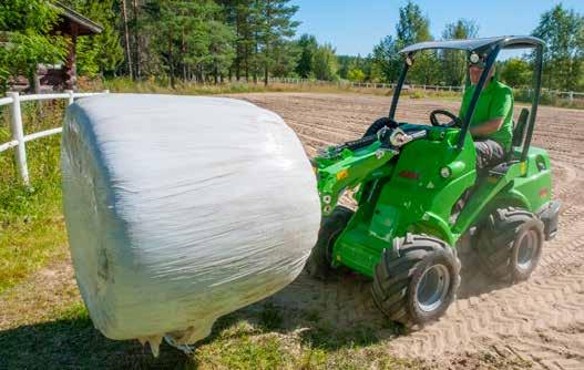 Farming and horse stables Bale fork With the round bale fork transporting and