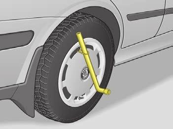 DO-IT-YOURSELF n Attach the wire hook (from the car tool kit) at the edge of the full wheel trim* opposite the air valve.
