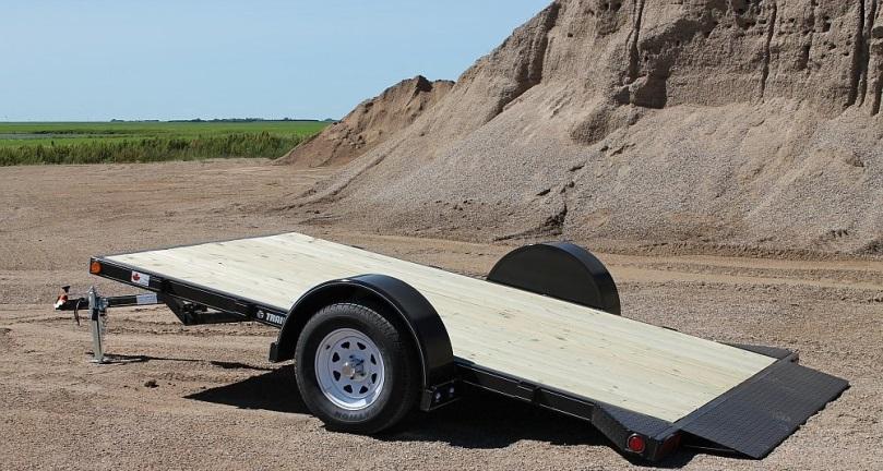 Flat Bed Tilt Trailers may tilt manually or hydraulically.