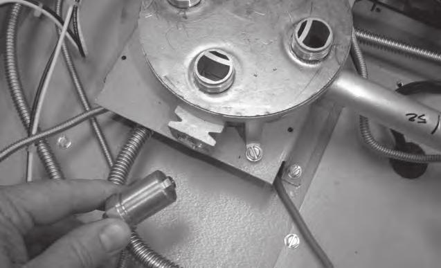 Tighten the replacement orifice into place with a 7 mm hex wrench. Repeat the above steps for the other crown burner if it requires service.