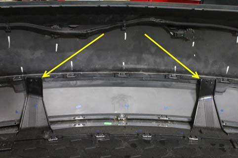 8. Once the bumper cover and rear under spoiler combination is removed from the vehicle, there will be 2 plastic push-type fasteners and 2 screws that are used to attach the rear under spoiler to the