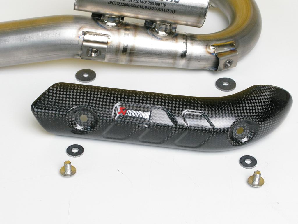 Assemble the carbon fiber heat shield onto the header tube, using Akrapovič bolts and heat resistant washers (Figure 7, 8).