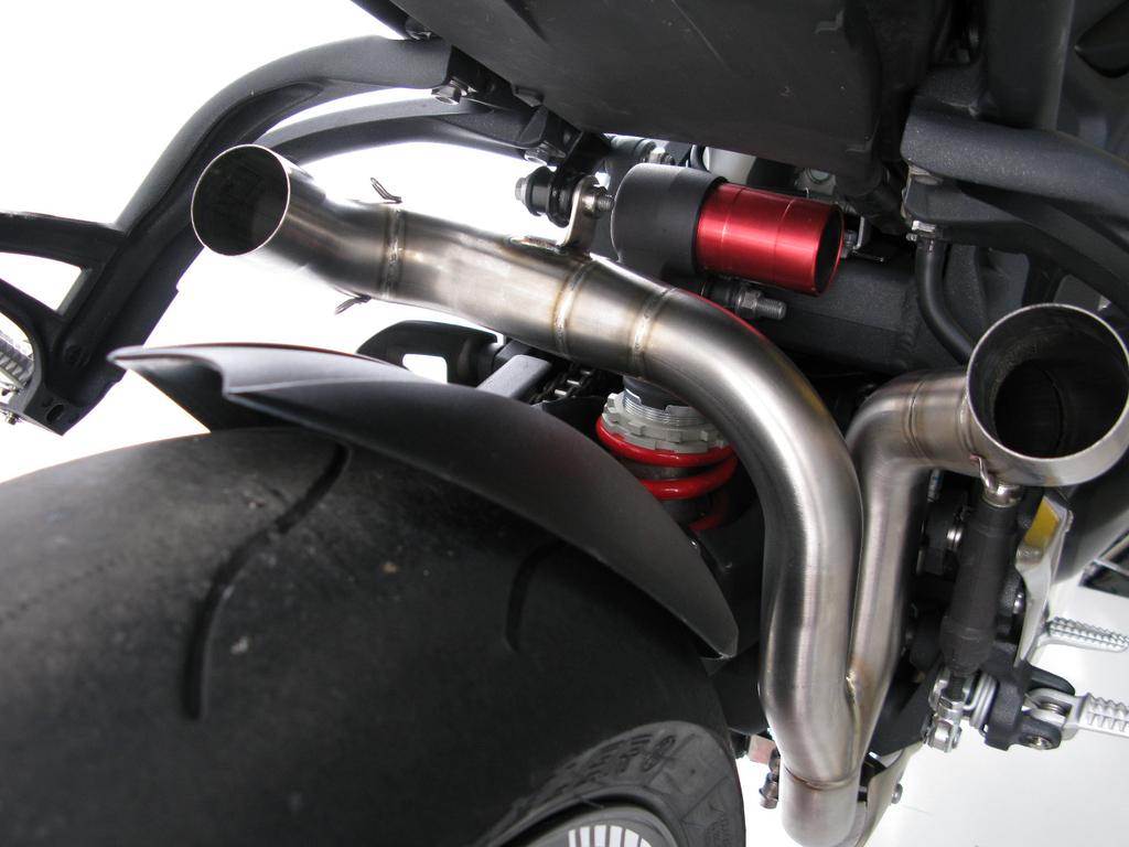 2. Correctly position and slide the Akrapovič link pipe onto the stock header pipe, hand tighten the metal clamp and brackets bolt - use stock bolt (Figure