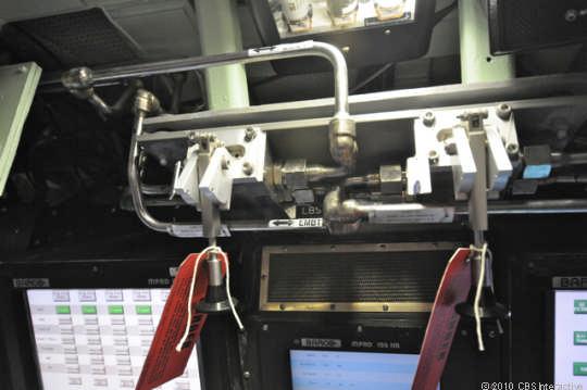 In an emergency, the submarine can be forced to the surface in a hurry by pulling these levers, which are located just above the pilots' electronic navigation station.