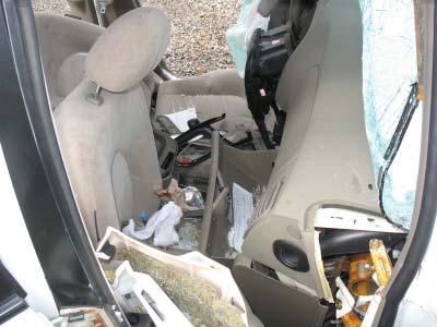 Interior Damage The interior of the Hyundai sustained severe right side intrusion. Figure 14 is a right lateral view across Row 1. The right floor pan deformed and buckled vertically.