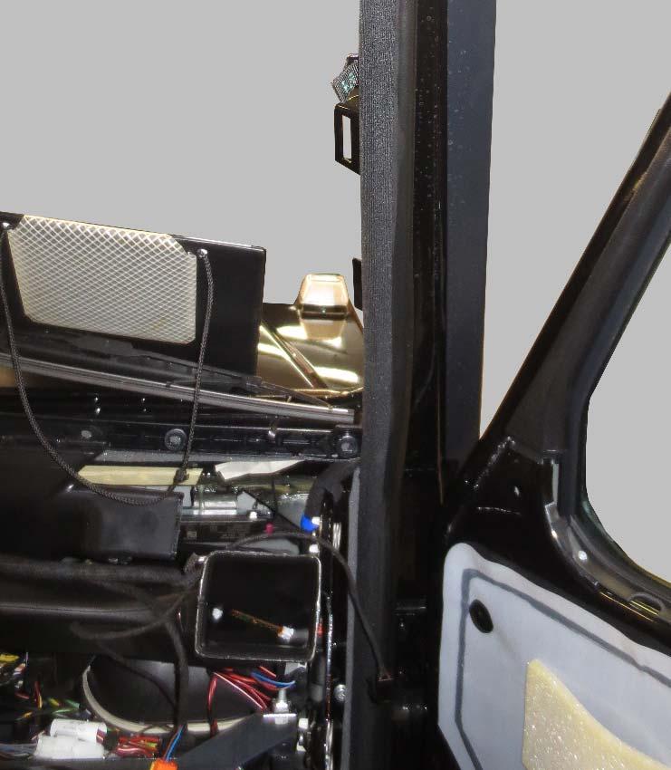- Route the wiring harness down into the passenger footwell