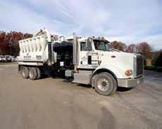 tailgate and locks, vibrator, Ingersoll Rand model S1AV8702 vacuum pump, hydraulic loading boom with 8 suction hose, wireless remote, PTO, 44,000# rears, 22,000# front, and 22,000 lift axle,