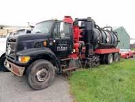 hydraulic loading boom with 315/80R22.5 front and 11R22.5 remote control, 46,000# rears and 20,000# front axle, Hendrickson spring/beam rear tires. In fair to good condition with fair to good tires.