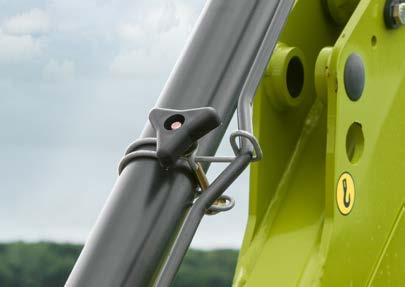 The pre-lock mechanism secures the connection before the front loader locks fully into position.