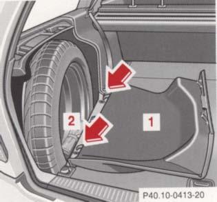 Spare Wheel, Vehicle Tools, 1 Trim panel, left side 2 Vehicle tools To open trim panel: Release lock and fold down.