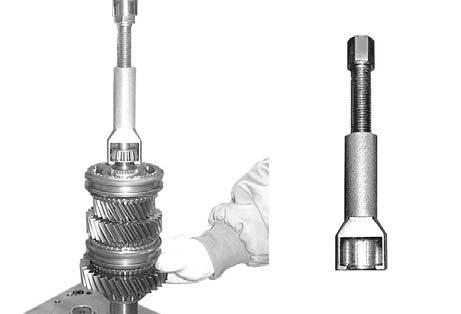 Place the output shaft assembly with the 1st facing down and remove the