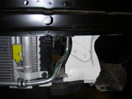 On each side, cut off two studs on the side of the radiator support (Fig.O).