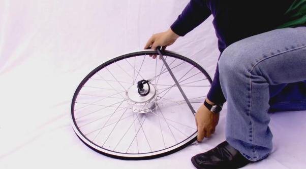 2a: Transfer rim tape and tyre Transfer the rim tape and tyre from the original wheel, to the