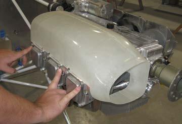 Sand or trim duct to fit on top of all of the cylinders on one side of the engine as shown in Figure 1. Notches are pre-cut to clear valve cover cap screws not used to attach the duct.