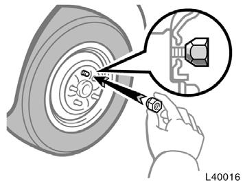 Reinstalling wheel nuts Lowering your vehicle CAUTION When lowering the vehicle, make sure all portions of your body and all other persons around will not be injured as the vehicle is lowered to the