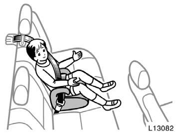 To remove the convertible seat, press the buckle release button and allow the belt to retract completely.