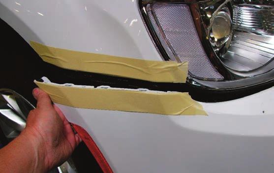 Pull out of the sides of the bumper cover to release