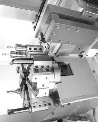 The 8-station turret clears 6 diameter work holding devices without interference, even when loaded with tooling at maximum shank size. The heavy-duty servo indexing turret achieves 0.