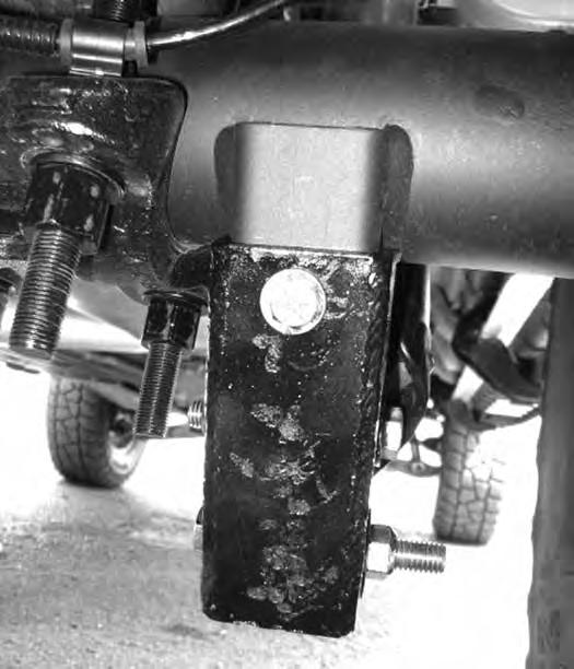 Retain mounting hardware. 70. Support the rear axle with a hydraulic jack. Remove the OE shocks. Discard hardware. Note: Perform the rear installation on one side at a time. 71.