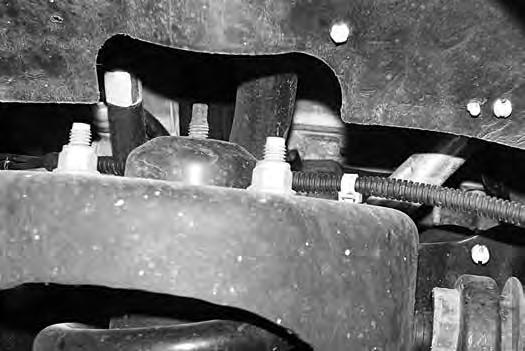 FIGURE 9 15. Remove the upper and lower ball joint nuts, refrain from hitting the aluminum steering knuckle, use appropriate tool to separate ball joints, avoid damaging the threads. 16.
