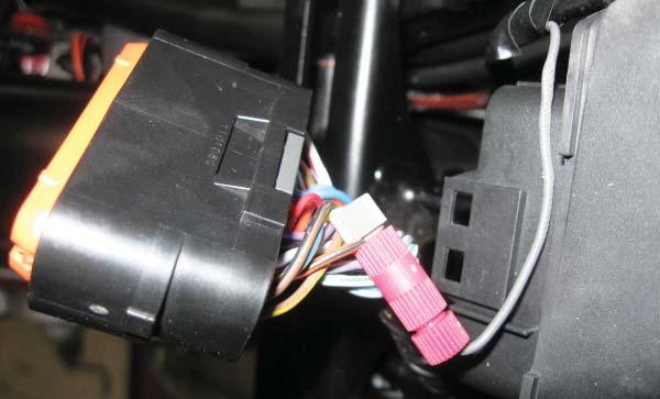 in Figure T. This is the third wire from the end, on the top row of the ECU. FIG.U 9 Locate the stock O2 sensor connection.