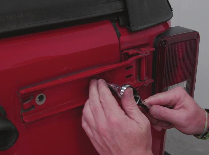 Remove the small cover using a screwdriver or plastic trim removal tool to gently pry