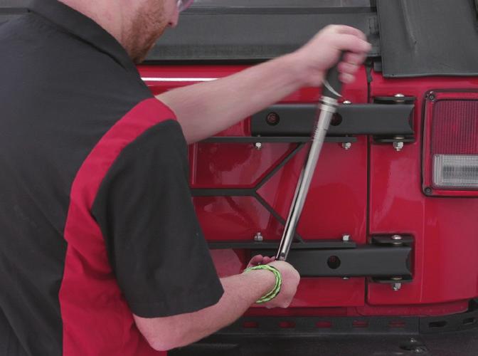 With the rear hinge in position, tighten the two factory M8 hex bolts to secure the