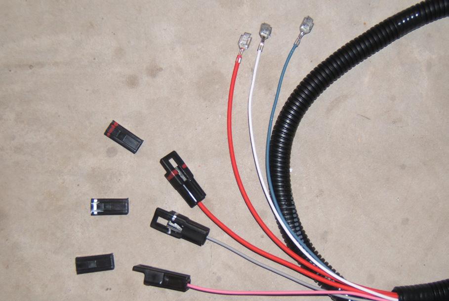 To do that we will remove several wires from the Reel Raise/Lower switch connector body, reroute, and replace them with other wires from the adapter harness. 1.
