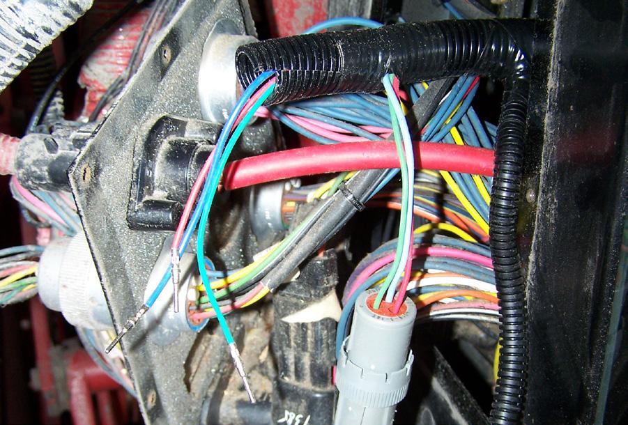 Open the access panel to the right of the cab and clean the cab wiring access plate area thoroughly. 2.