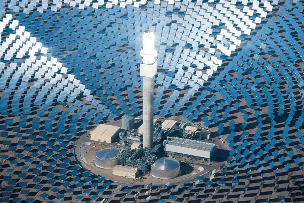 Figure 12 Solar Concentrator Tower and TES Tanks. Source: [42]. D. MEETING NAVY ENERGY GOALS Utilization of EES is the key to meeting the SECNAV s priority of energy independence.