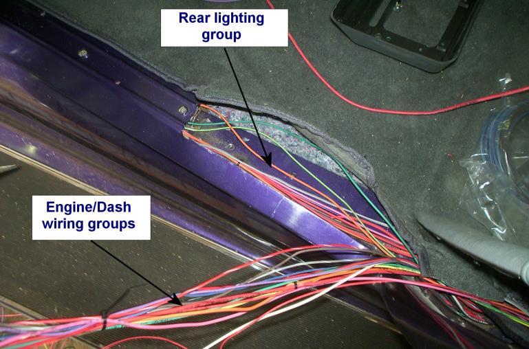 Remember, in this job, we used a trunkmounted kit, so all the wires pass from the rear to the front. You will most likely need to make more room.