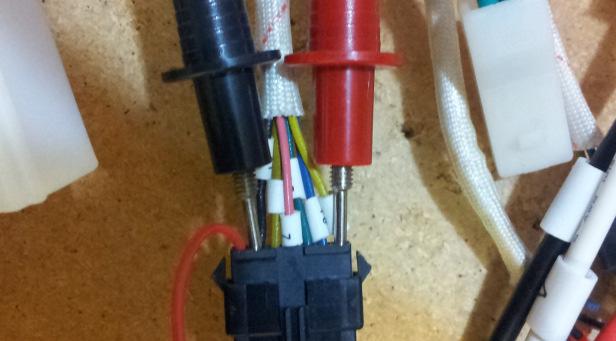 Put the multi meter positive probe into the back of the 7 pin motor connector on the other side so as not to get a short between