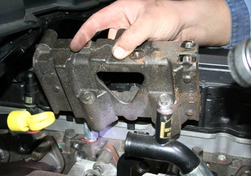 Remove the cooler mount bolts to the head (13mm socket) and remove the cooler mount from the vehicle. 17.