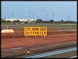 Aprons adjoining Taxiways have a sign advising to make contact with Broome Ground for a clearance.