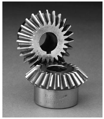 Bevel Gears Bevel gears are cut on conical blanks to be used to transmit motion between intersecting shafts.