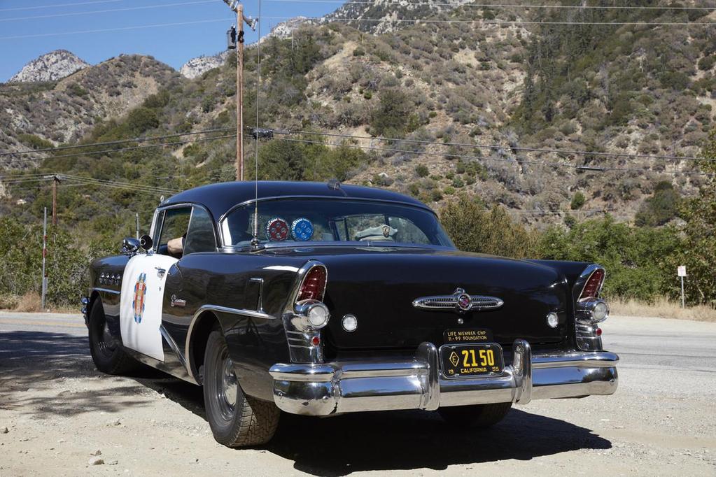 The car from behind, showing the 2150 license plate Broderick Crawford s car number on the show Highway Patrol.