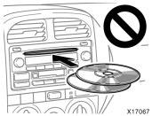 YOUR COMPACT DISC PLAYER When you insert a disc, gently push it in with the label side up. (The player will automatically eject a disc if the label side is down.