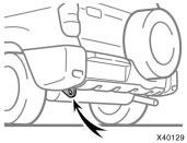 the front of the vehicle or the left emergency towing eyelet under the rear of the vehicle. Use extreme caution when towing vehicle.
