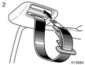 Tumbling rear seats BEFORE TUMBLING REAR SEAT 1. Stow the rear seat belt buckles as shown in the illustration. This prevents the buckles from falling out when you tumble the rear seat.