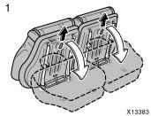 To unlock the seat, hold the upper back of the seat with your hand and pull the lock release strap up.