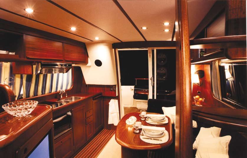 Sliding glass door to aft deck Pilot House Door to side deck on port side Helmsman seat Large L-shaped passenger sofa with table Stairs to flying bridge Helmsman s position includes: Autopilot,