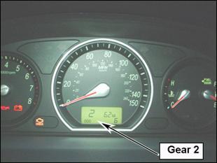 Press and hold the brake pedal, then fully depress the accelerator and record the engine speed. CAUTION Do not hold the throttle fully open for more than 3 seconds.