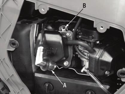 2) Loosen and remove the oil drain bolt (B) if needed tilt the generator forward and drain the oil from the engine.