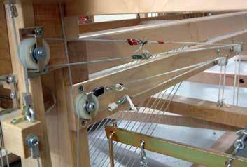 Make sure the treadle cables are installed properly and in the groove of each pulley.