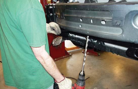 Repeat the process for the center mounting point as well, drilling up through the bottom layer of the bumper core (Fig.Q).