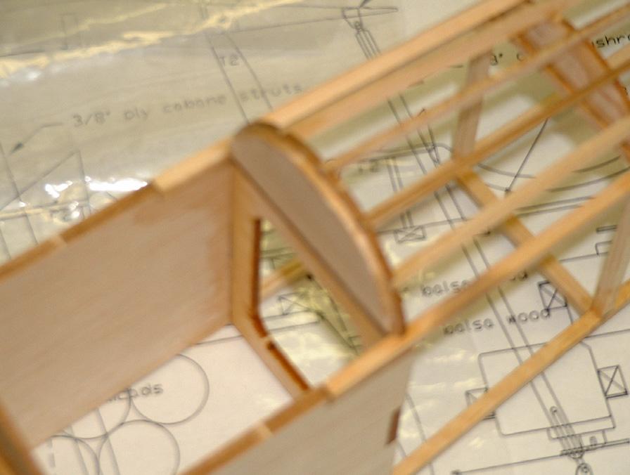 structures remain perfectly aligned. Next, build the front fuselage structure and add the cabane struts while the sides are flush with the plan.