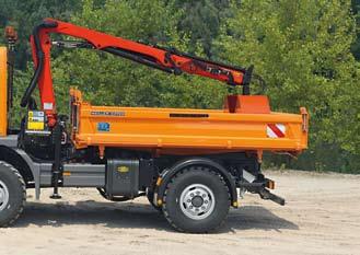 Ladder for accessing the tipper body can be mounted in the side wall when folded down, and stored under the