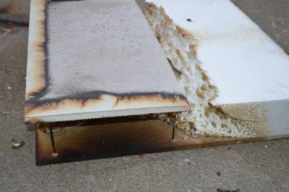 The EPS insulation had melted away in an area at the edge of the test specimen and there was significant discolouration of the backing board at that edge.