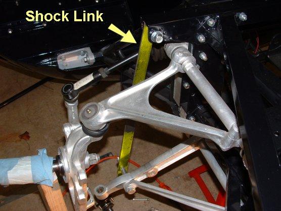 The distance between the mounting holes of this bar will dictate the car's final ride height. The shop manual calls for a shock link with 17-13/16 inches between the holes.
